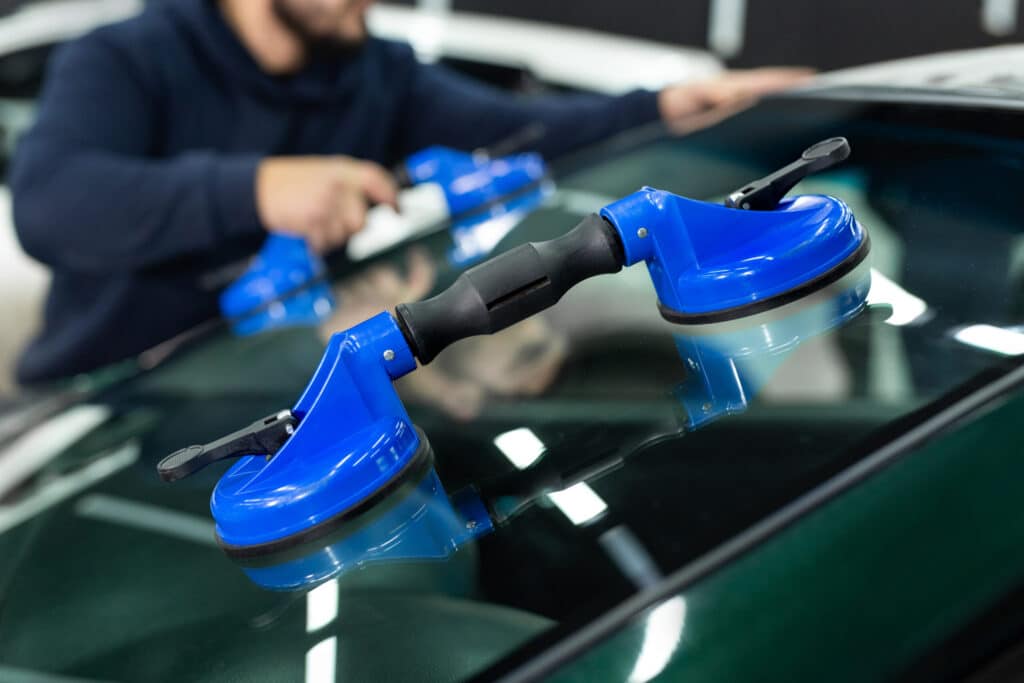 tech setting windshield with suction cups - windshield replacement
